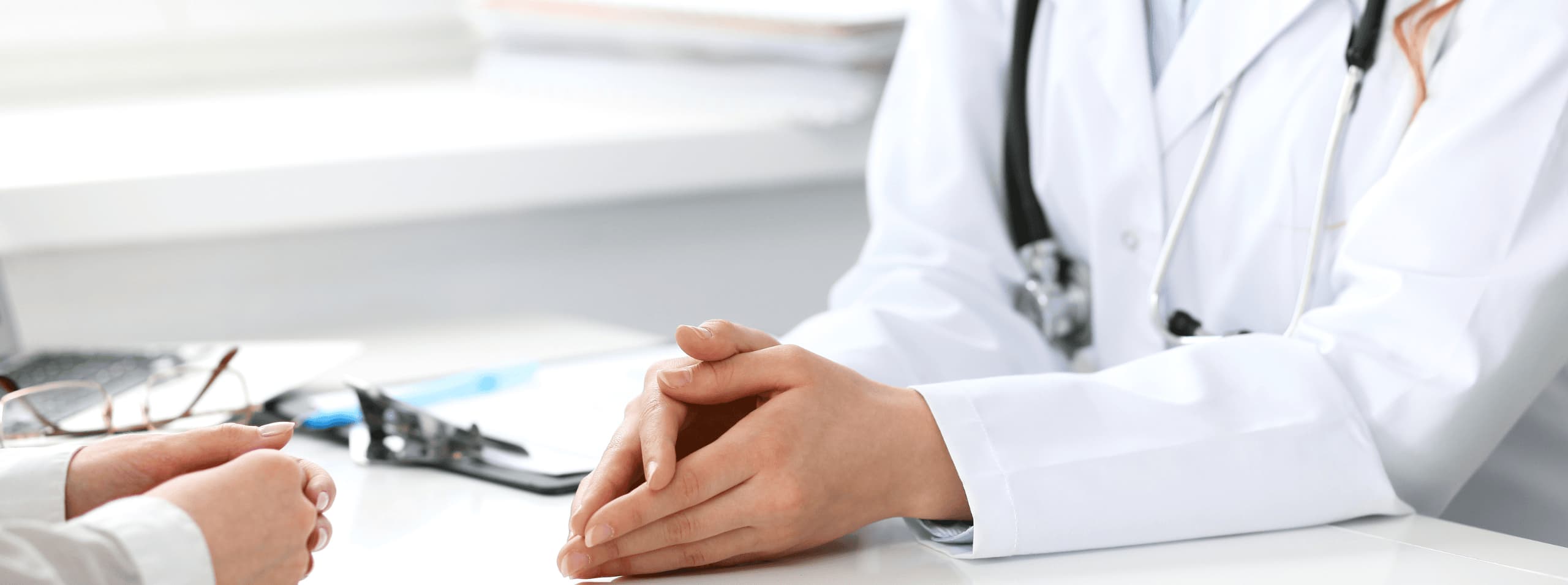 A VERSAL physician talking through results with a patient